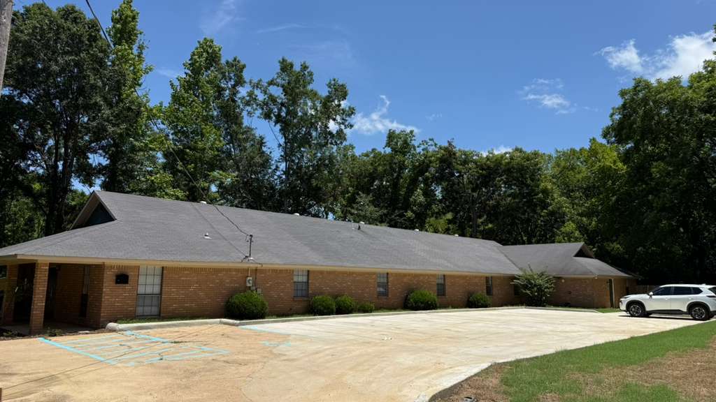 Exterior and parking area at Madison Heights Assisted Living
